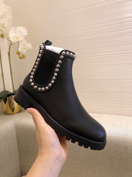 Christian Louboutine Black platform rivet boots.