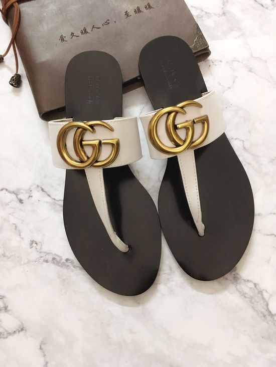 Gucci Cowhide Upper Flip Flops with Metal Decor