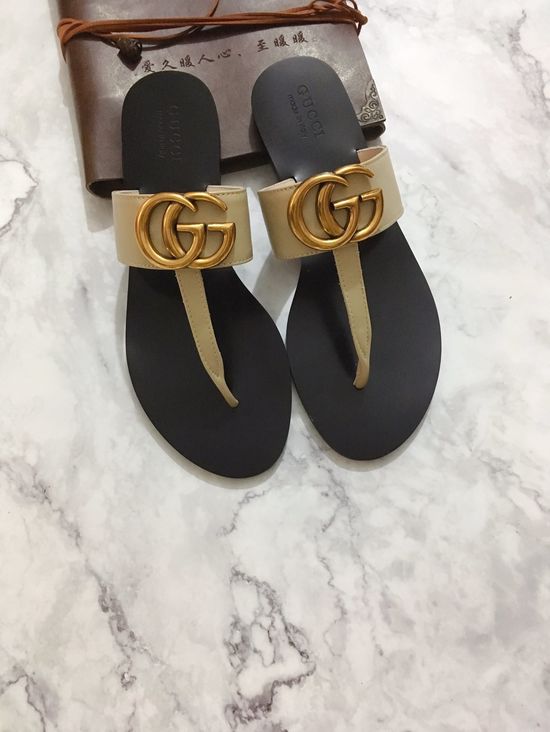 Gucci Cowhide Upper Flip Flops with Metal Decor