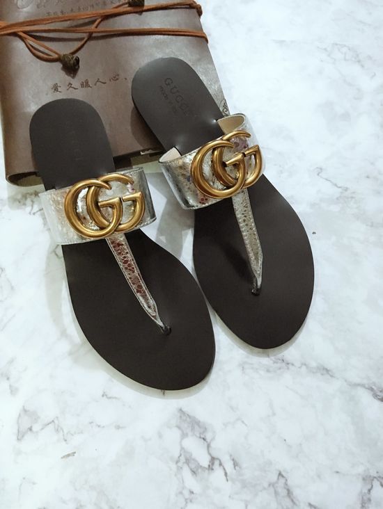 Gucci Cowhide Upper Flip Flops with Metal Decor