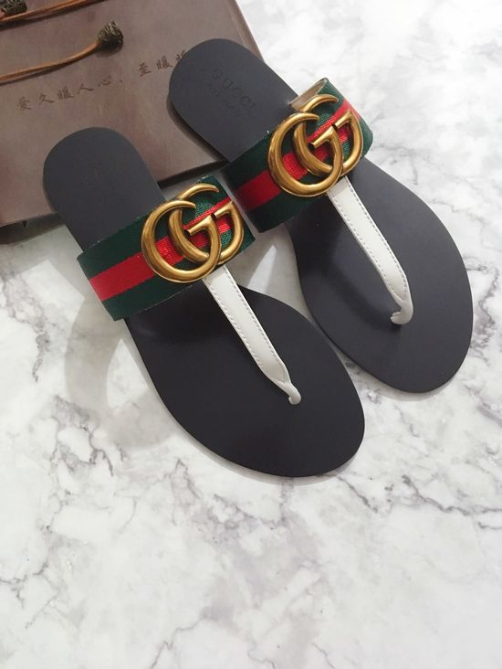 Gucci Cowhide Upper Flip Flops with Metal Decor