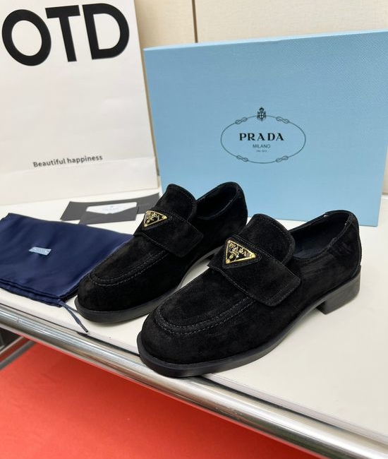 Prada Soft Leather Round Toe Loafers with Logo Buckle