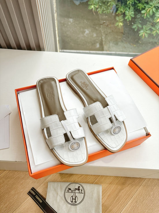 Hermes Flat Slide Sandals with Metal Lock Buckle and Leather Upper