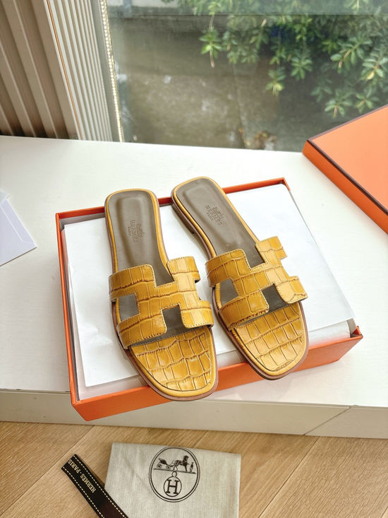 Hermes Flat Slide Sandals with Metal Lock Buckle and Leather Upper