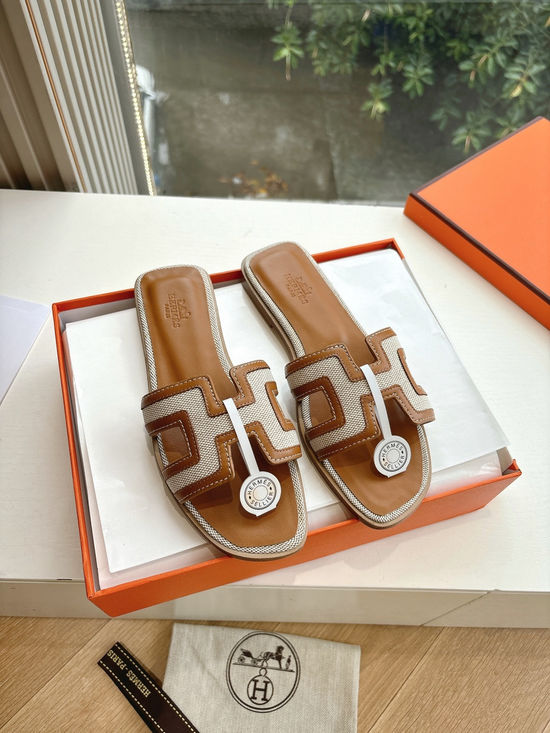 Hermes Flat Slide Sandals with Metal Lock Buckle and Leather Upper
