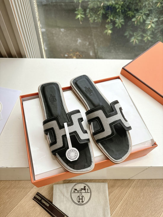 Hermes Flat Slide Sandals with Metal Lock Buckle and Leather Upper