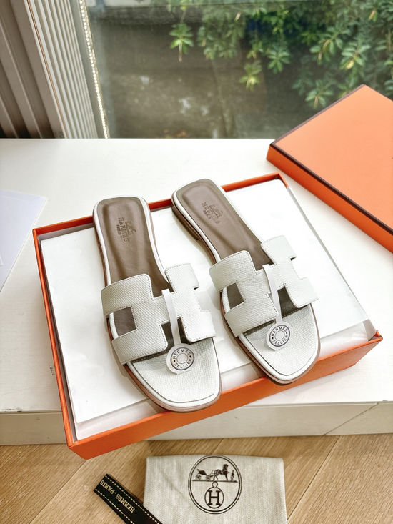 Hermes Flat Slide Sandals with Metal Lock Buckle and Leather Upper