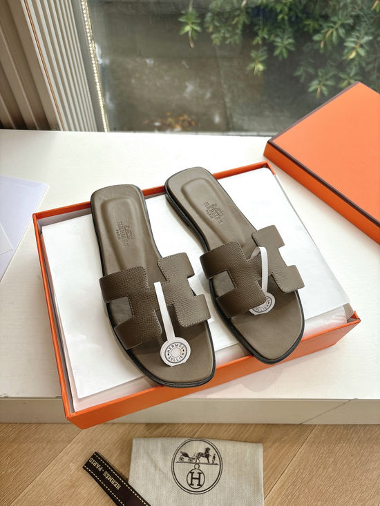 Hermes Flat Slide Sandals with Metal Lock Buckle and Leather Upper