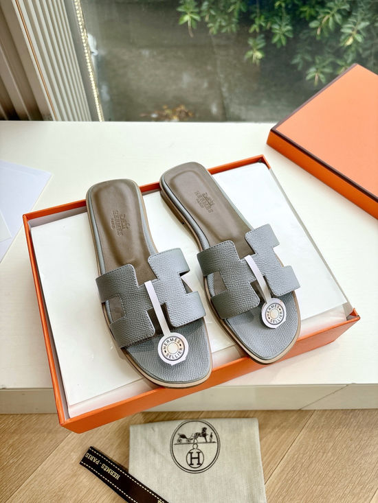 Hermes Flat Slide Sandals with Metal Lock Buckle and Leather Upper
