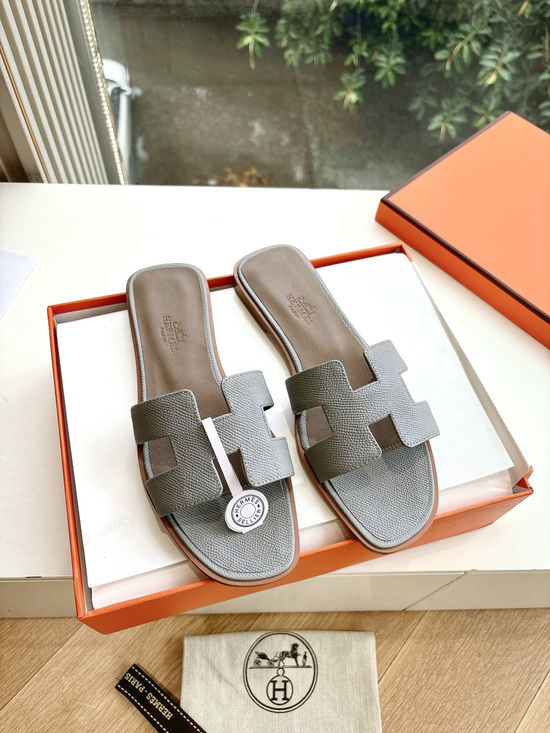 Hermes Flat Slide Sandals with Metal Lock Buckle and Leather Upper