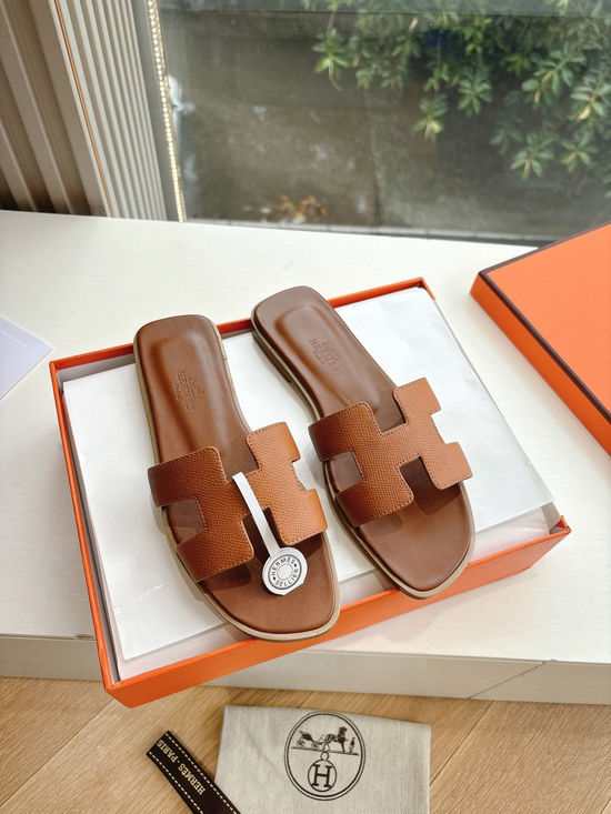Hermes Flat Slide Sandals with Metal Lock Buckle and Leather Upper