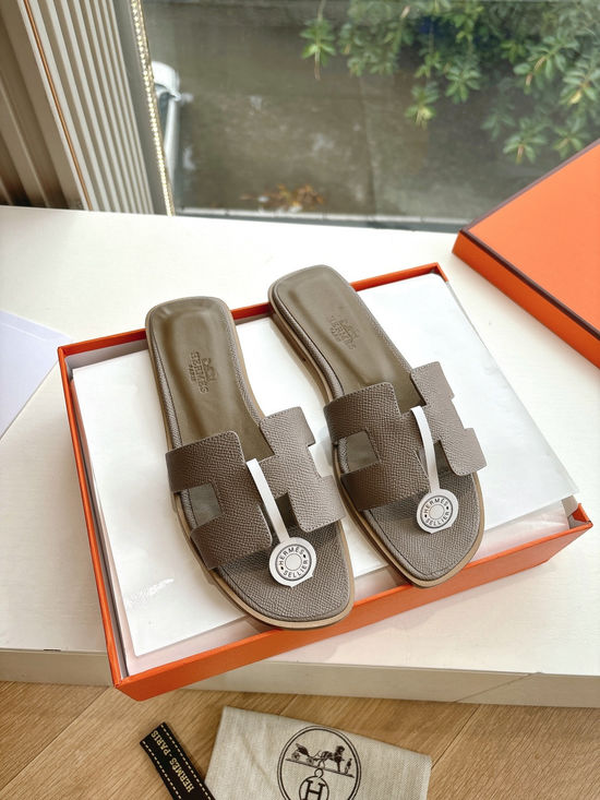 Hermes Flat Slide Sandals with Metal Lock Buckle and Leather Upper