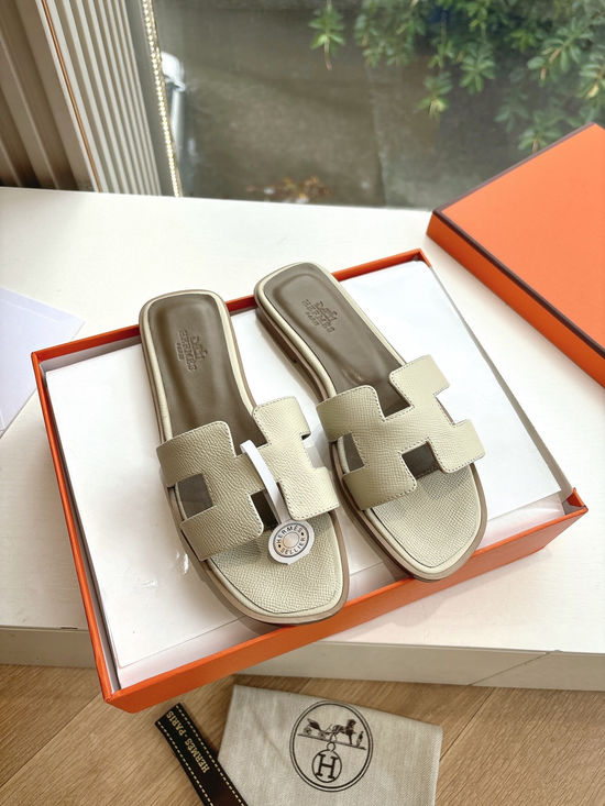 Hermes Flat Slide Sandals with Metal Lock Buckle and Leather Upper