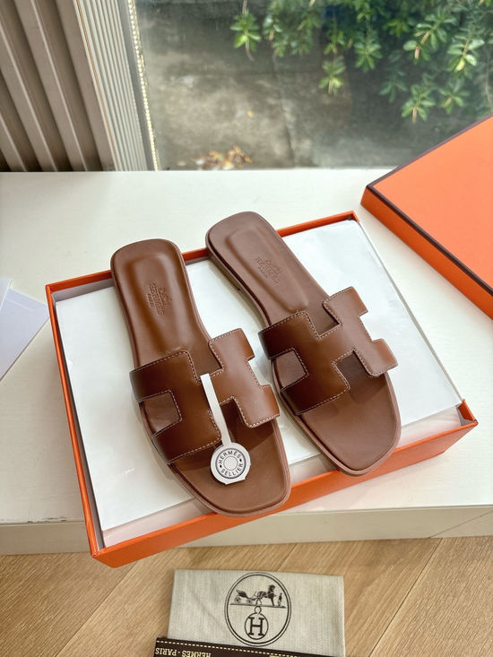 Hermes Flat Slide Sandals with Metal Lock Buckle and Leather Upper