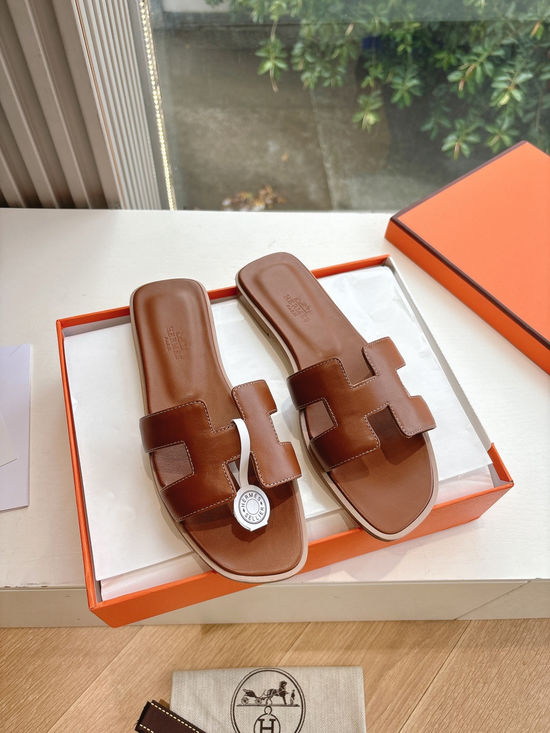 Hermes Flat Slide Sandals with Metal Lock Buckle and Leather Upper