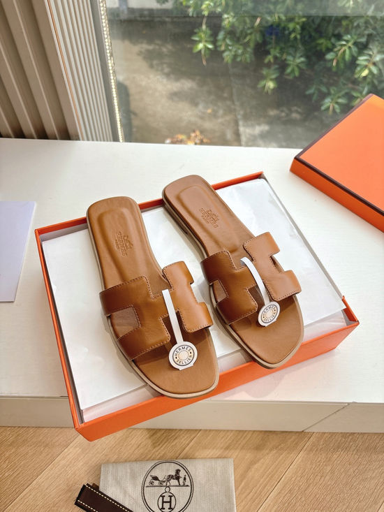 Hermes Flat Slide Sandals with Metal Lock Buckle and Leather Upper