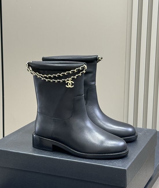 Chanel Elegant Leather Ankle Boots With Decorative Chain Detail
