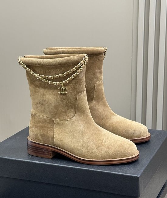 Chanel Elegant Leather Ankle Boots With Decorative Chain Detail