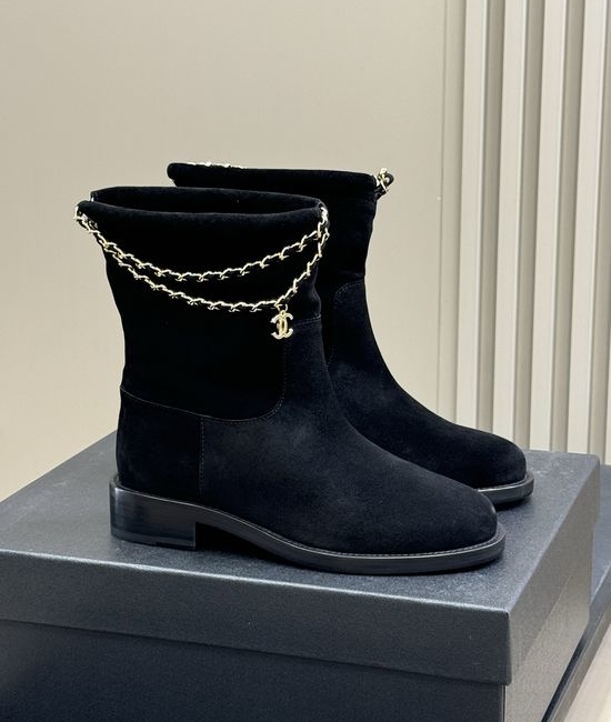 Chanel Elegant Leather Ankle Boots With Decorative Chain Detail