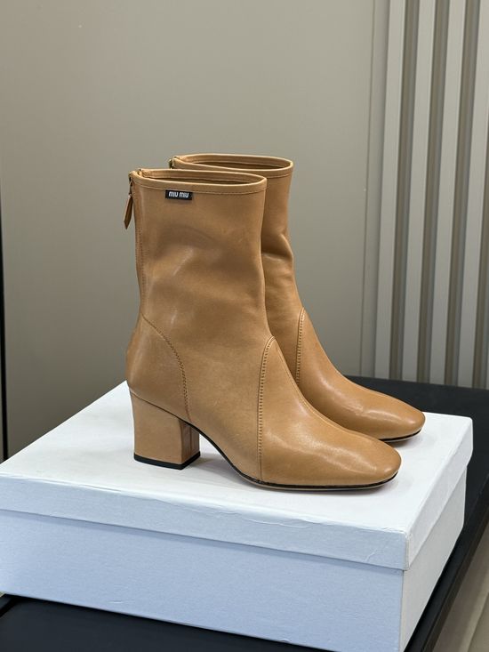 Miu Miu Knee High Stretch Boots With Decorative Metal Buckle
