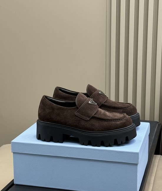 Prada Premium Leather Loafers With Gold Emblem And Chunky Heel