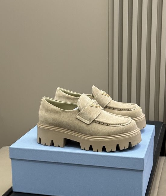 Prada Premium Leather Loafers With Gold Emblem And Chunky Heel