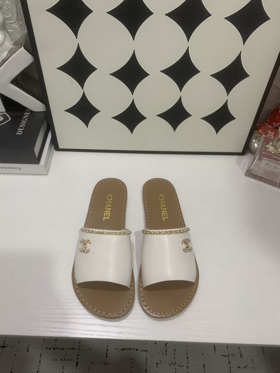 Chanel Genuine Leather Slip On Shoes with Metal Hardware