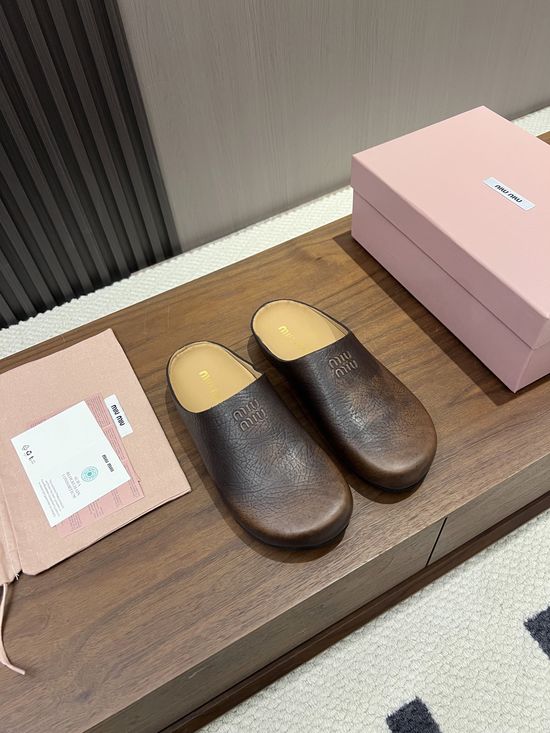 Miu Miu Hidden Lift Casual Clog Shoes With Embossed Logo