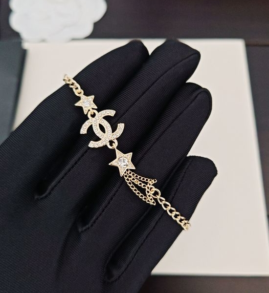 Chanel Brass Star Double C Charm Bracelet