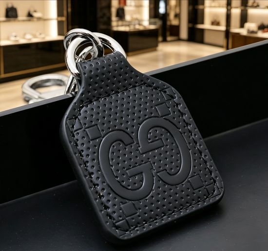 Gucci Embossed Logo Keychain Bag Charm