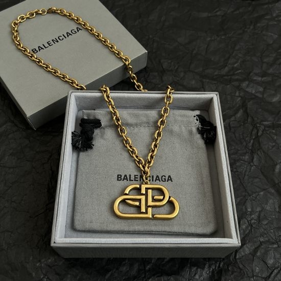 Balenciaga Elegant Textured Gold Pendant Necklace