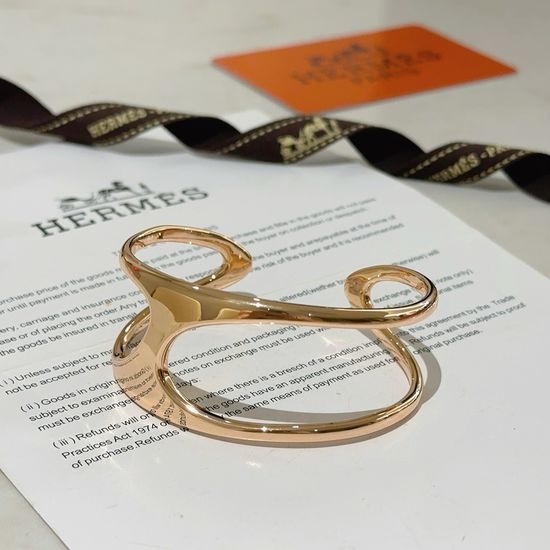 Hermes Adjustable Opening Plated Gold Bracelet