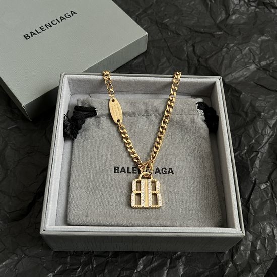 Balenciaga Minimalist Gold Tone Pendant Necklace